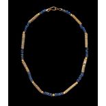 A Roman Gold and Glass Bead Necklace Length 9 3/4 inches (25 cm).