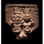 A Romano-Egyptian Terracotta Plaque of Bes and Bessette Height 5 inches (12.7 cm).