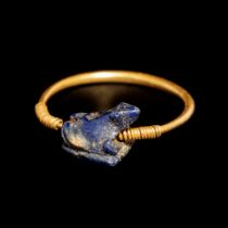 A Phoenician Gold Finger Ring with Blue Glass Frog Seal Ring size 7 1/2; Length of frog 1/4 inch (0.