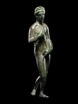 A Roman Bronze Venus with Silver Inlaid Eyes  Height 5 13/32 inches (13.7 cm).
