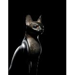 An Egyptian Bronze Cat Height 7 1/2 inches (19 cm).