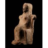 A Greek Terracotta of a Seated Female Deity Height 4 1/4 inches (10.8 cm).