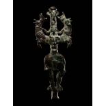 A Luristan Bronze Master of the Animals Finial Height 7 1/2 inches (19.7 cm).