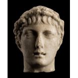 A Roman Marble Head of a Youth with Laurel Wreath Height 4 1/2 inches (11.4 cm).