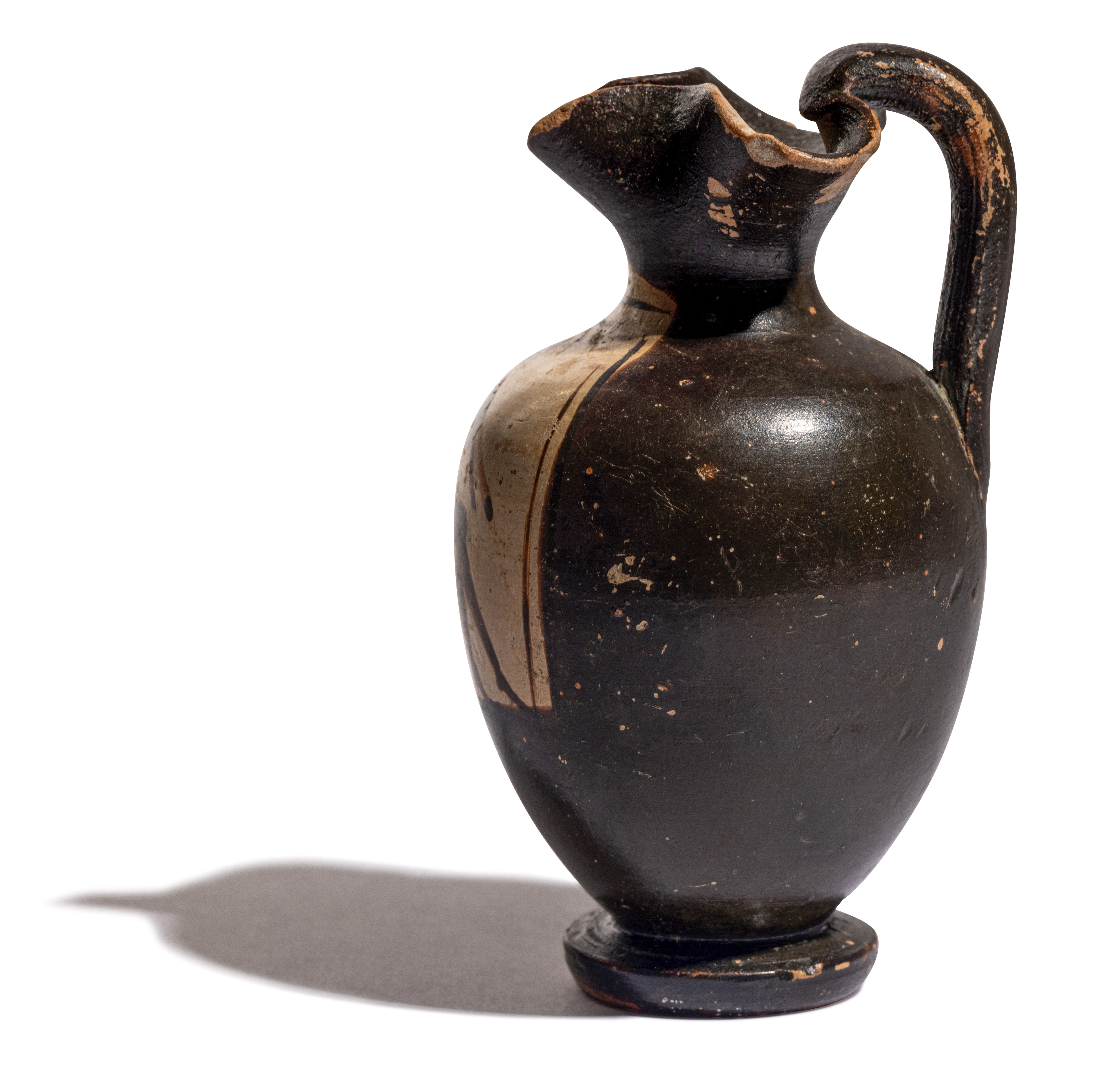 A Greek Black-Figured Trefoil Oinochoe Height 3 3/4 inches (10 cm). - Image 12 of 12