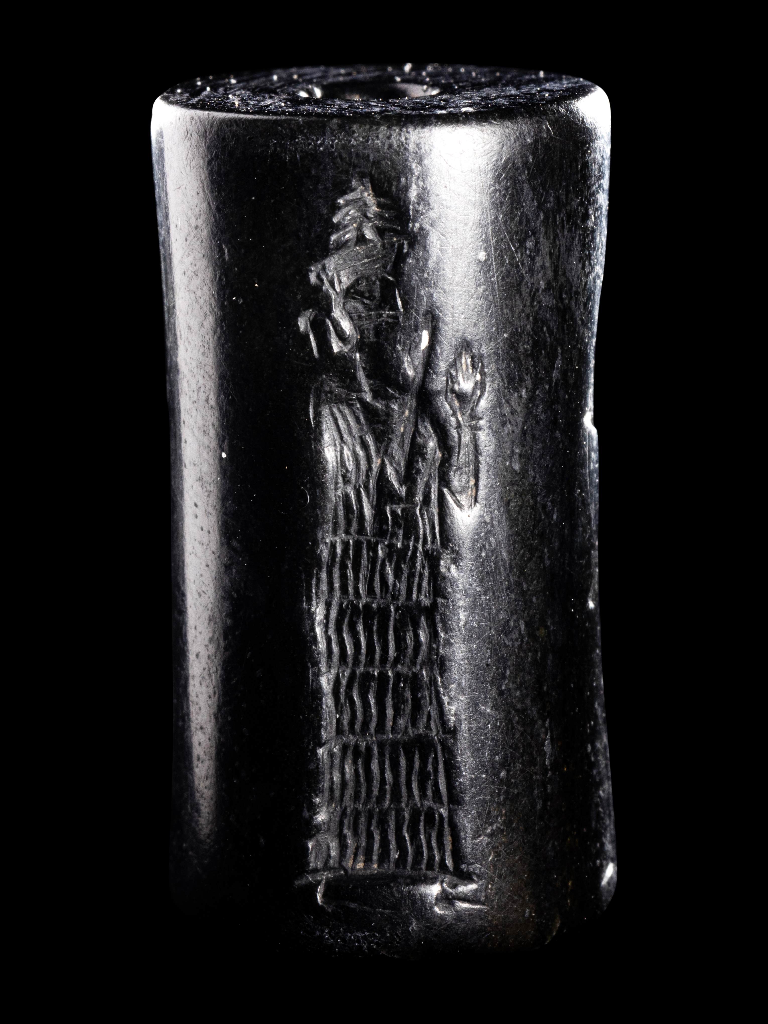 A Mesopotamian Hematite Cylinder Seal Height 1 1/16 inches (2.7 cm). - Image 4 of 4