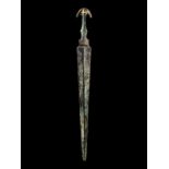 A Luristan Bronze Sword Height 22 inches (55.4 cm).