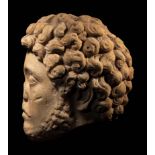 A Roman Marble Portrait Head of Marcus Aurelius from a Relief Height 7 1/2 inches (19 cm).