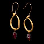 A Pair of Roman Gold and Garnet Earrings Length 1 1/8 inches (3 cm).