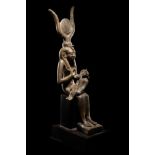 An Egyptian Bronze Isis and Horus  Height 6 1/4 inches (16 cm).