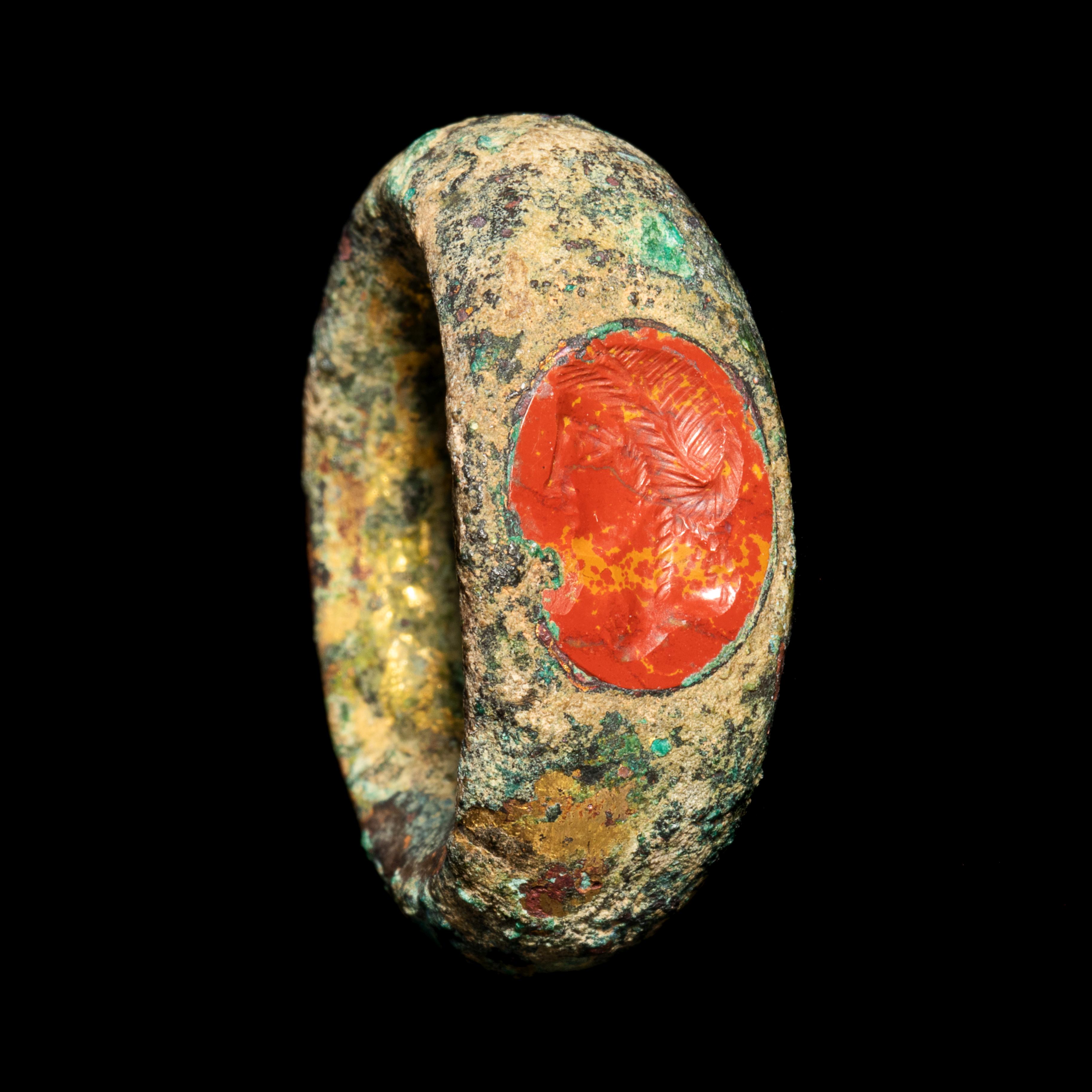 A Roman Gilt-Bronze Finger Ring with a Red Jasper Intaglio of Agrippina  Ring size 4 1/2; Diameter o