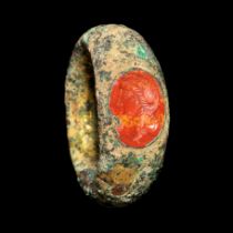 A Roman Gilt-Bronze Finger Ring with a Red Jasper Intaglio of Agrippina  Ring size 4 1/2; Diameter o