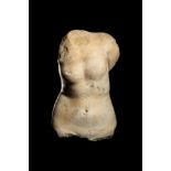 A Roman Marble Torso of Venus Height 8 inches (20.32 cm).