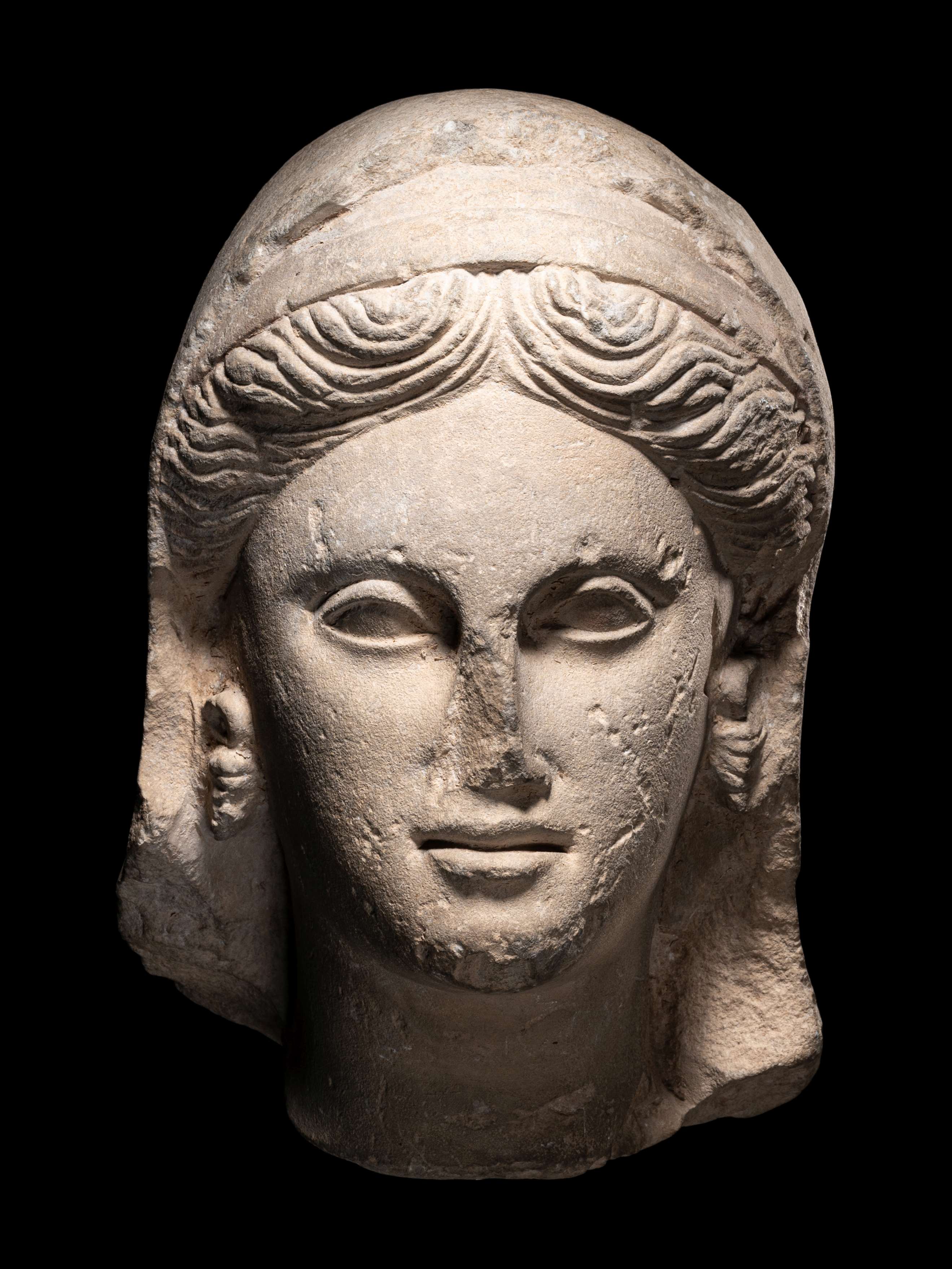 A Greek Limestone Head of a Woman Height 13 inches (33 cm). - Image 2 of 7
