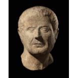 A Roman Marble Portrait Head of a Man Height 16 inches (41 cm).