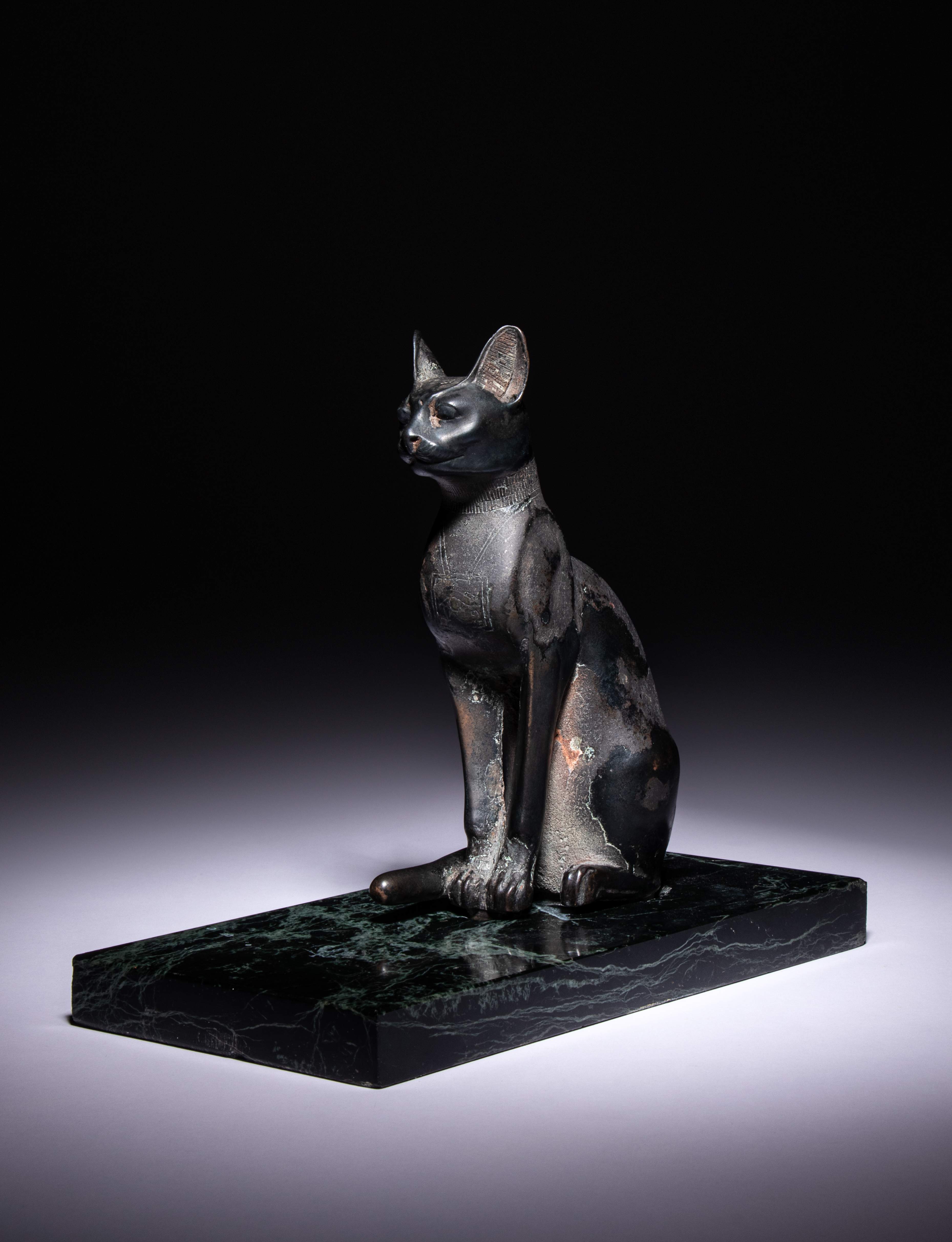 An Egyptian Bronze Cat Height 7 1/2 inches (19 cm). - Image 3 of 10