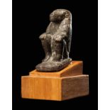 An Egyptian Serpentine Baboon Height 2 3/4 inches (7 cm).