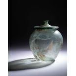 A Roman Blue-Green Glass Cinerary Urn Height 6 1/2 inches (16.8 cm).