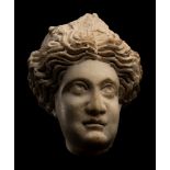 A Roman Marble Head of a Woman Height 5 inches (12.7 cm).