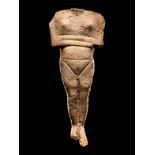 A Cycladic Marble Reclining Female Figure Height 10 inches (25 cm).