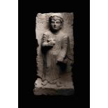 A Palmyran Limestone Relief of a Woman Height 19 7/8 inches (50.5 cm).