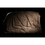 An Egyptian Sandstone Relief Length 17 1/2 inches (44.5 cm).