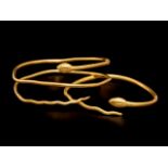 Two Romano-Egyptian Gold Snake Bracelets Diameter of largest 2 3/4 inches (7 cm).