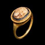 A Roman Gold Finger Ring with Glass Cameo of Eros Ring size 5 1/4; Diameter of cameo 3/8 inch (1 cm)