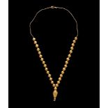 An Achaemenid Hollow Gold Bead Necklace Length 14 3/8 inches (36.5 cm).