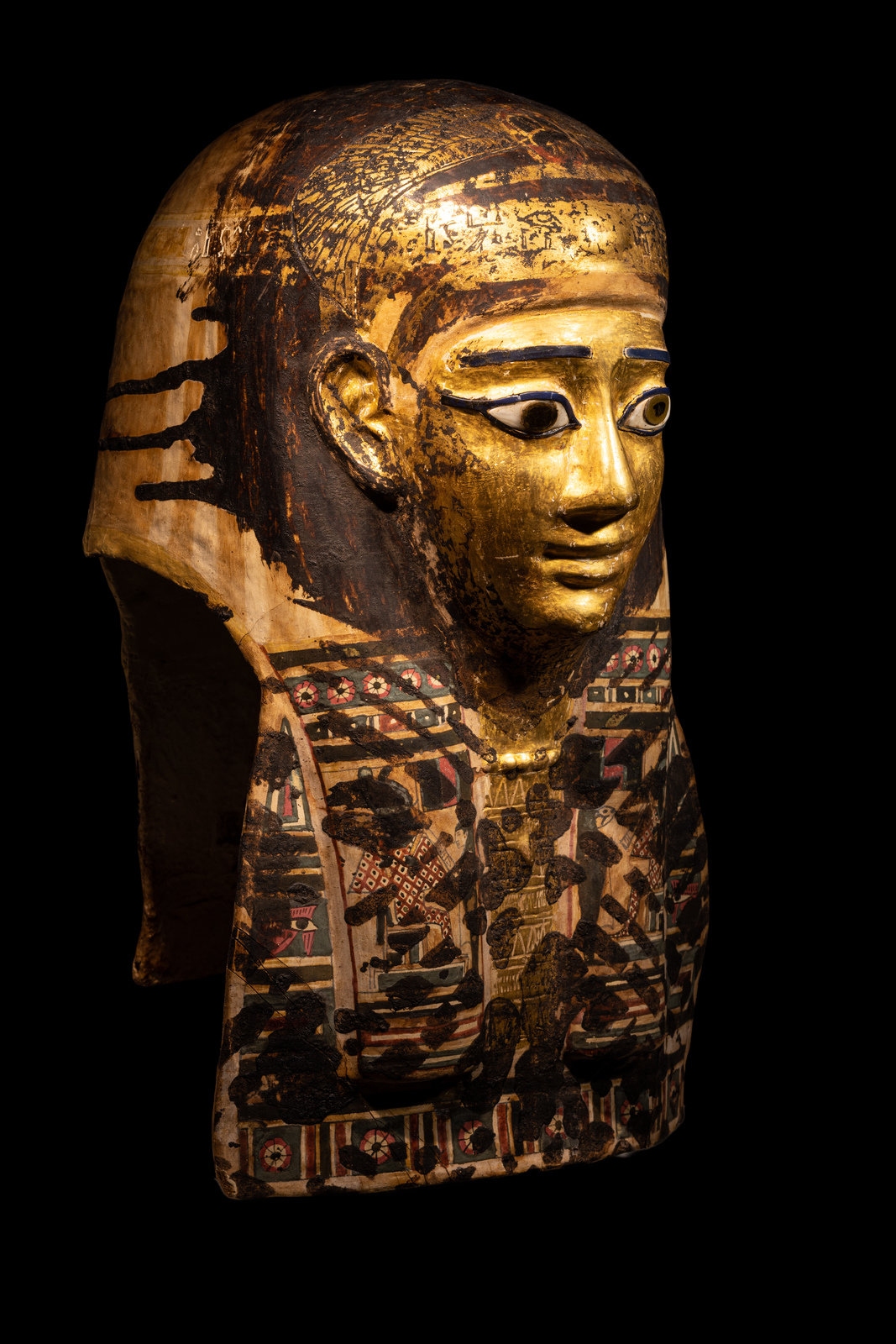 An Egyptian Gilt Cartonnage Mummy Mask Height 18 1/2 inches (47 cm). - Image 2 of 11