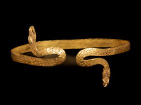 A Romano-Egyptian Gold Snake Bracelet Length 2 1/8 inches (5.5 cm).