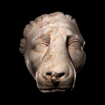 A Greek Marble Head of a Lion Height 9 inches (22.9 cm).