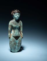 An Egyptian Faience Female Figure Height 5 1/8 inches (13.02 cm).