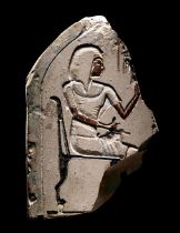 An Egyptian Painted Limestone Stele of Simut, Second Prophet of Amun Height 8 inches (20 cm).