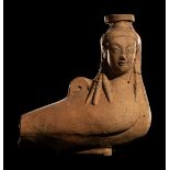 A Rhodian Pottery Figural Vessel in the Form of a Siren Height 5 inches (12.7 cm).