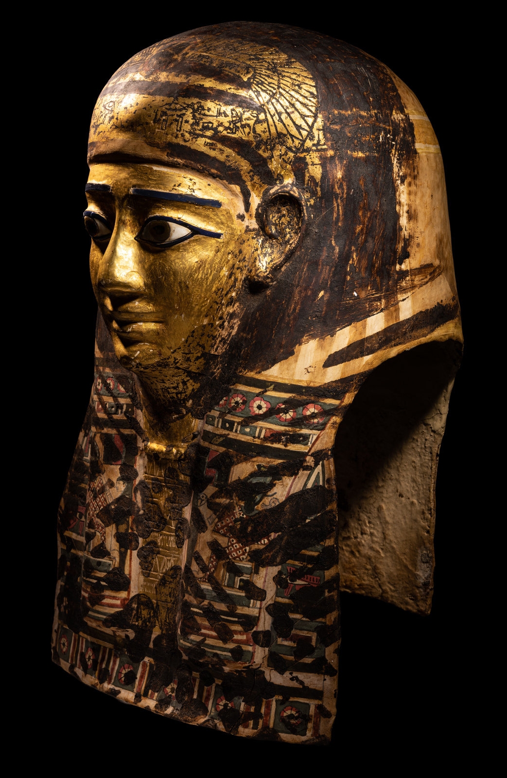 An Egyptian Gilt Cartonnage Mummy Mask Height 18 1/2 inches (47 cm). - Image 3 of 11
