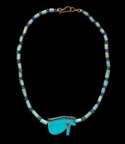 An Egyptian Faience and Blue Glass Bead Necklace  Length 8 1/8 inches (21 cm).