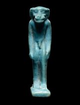 An Egyptian Faience Monkey Height 2 inches (5.3 cm).
