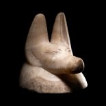 An Egyptian Alabaster Head of a Jackal Height 6 inches (15.2 cm).