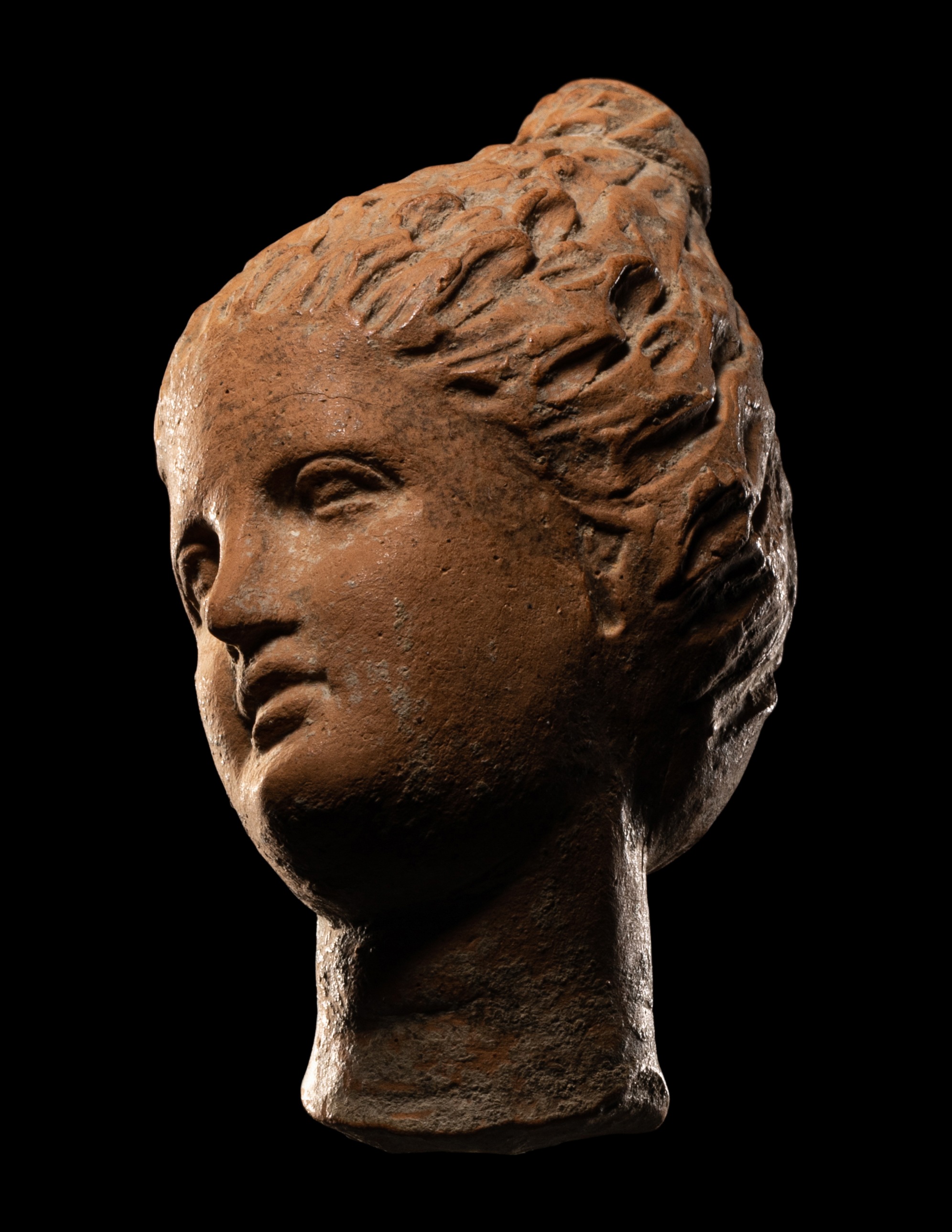 A Greek Terracotta Female Head with Melon Coiffure Height 3 inches (7.6 cm). - Image 3 of 8