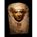 An Egyptian Cartonnage Mummy Mask Height 14 3/16 inches (36.1 cm).