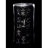 A Mesopotamian Hematite Cylinder Seal Height 1 1/16 inches (2.7 cm).