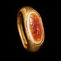 A Hellenistic Gold Finger Ring with Banded Agate Intaglio of Nude Deity Ring size 5 1/2; Diameter of