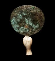 An Egyptian Bronze Mirror Height 8 inches (20 cm).