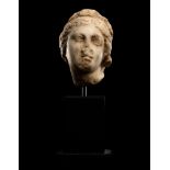 A Roman Marble Head of a Woman Height 3 3/16 inches (8.1 cm).
