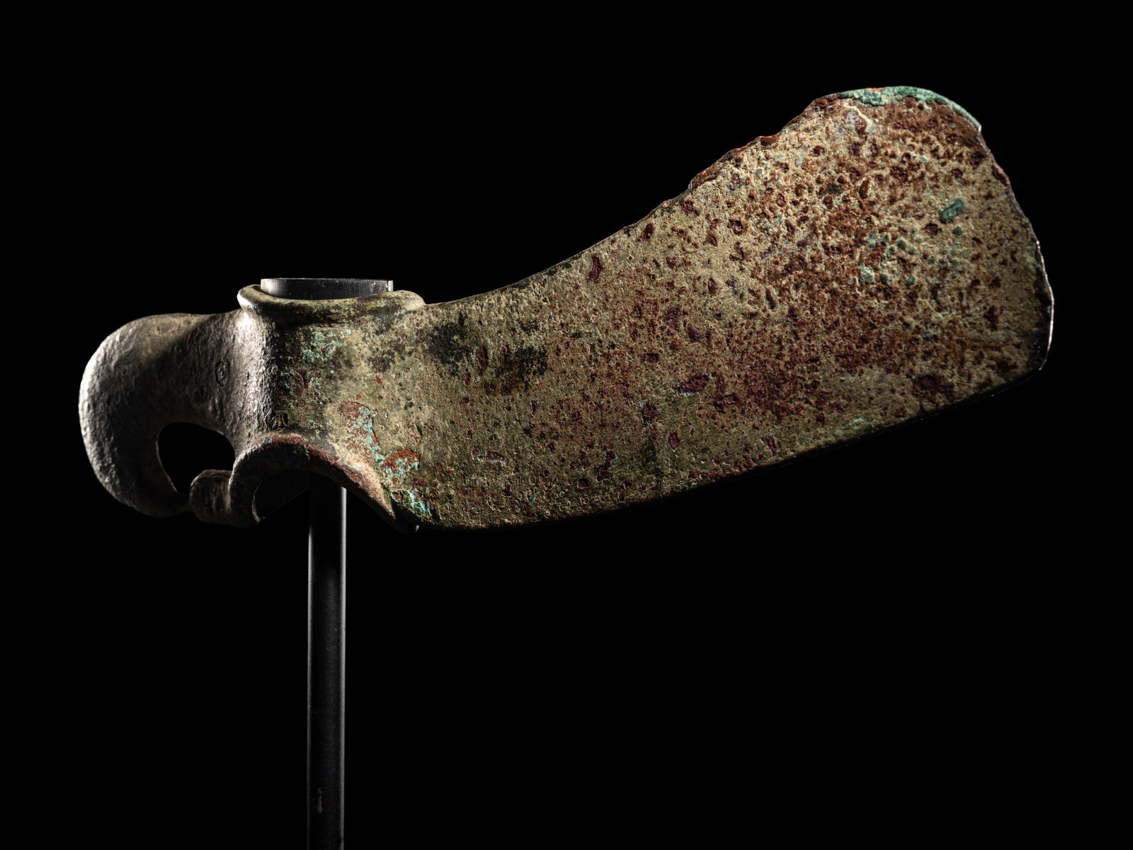 A Luristan Bronze Axehead Length 9 5/8 inches (24.5 cm).