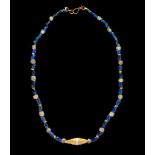 A Roman Gold and Glass Bead Necklace  Length 19 13/16 inches (25 cm).