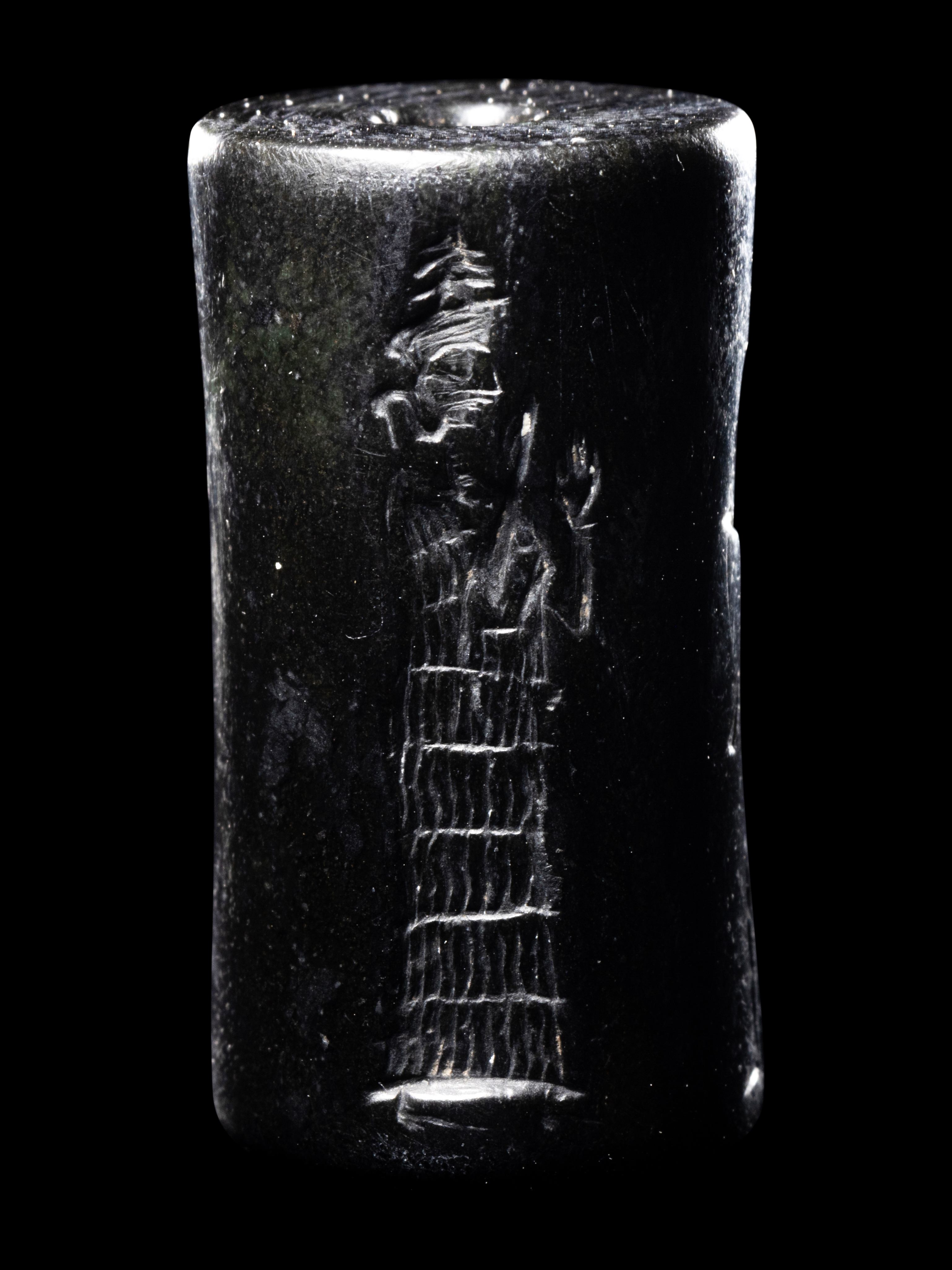 A Mesopotamian Hematite Cylinder Seal Height 1 1/16 inches (2.7 cm). - Image 3 of 4