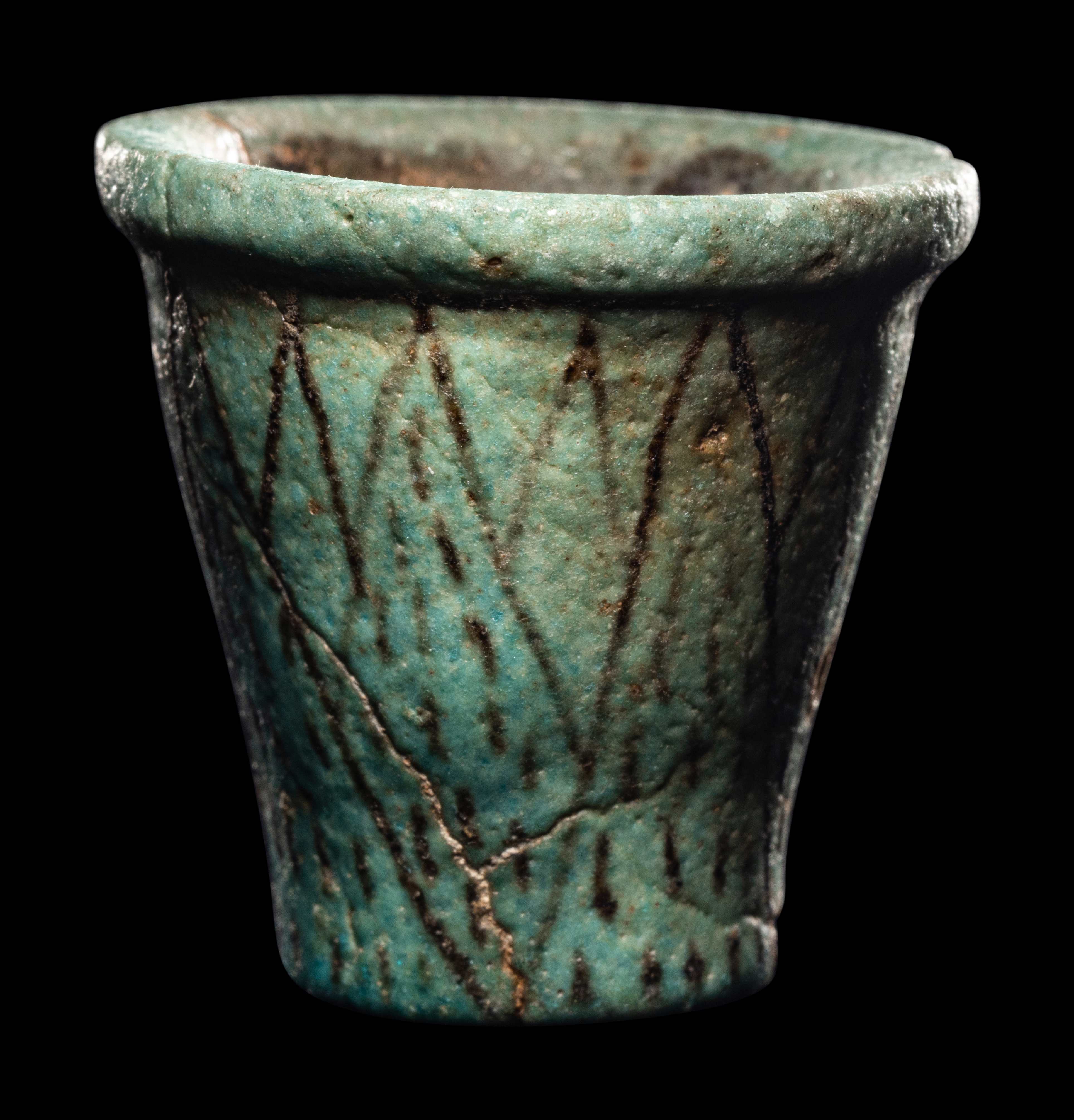 An Egyptian Faience Cup Height 2 inches (5.4 cm).