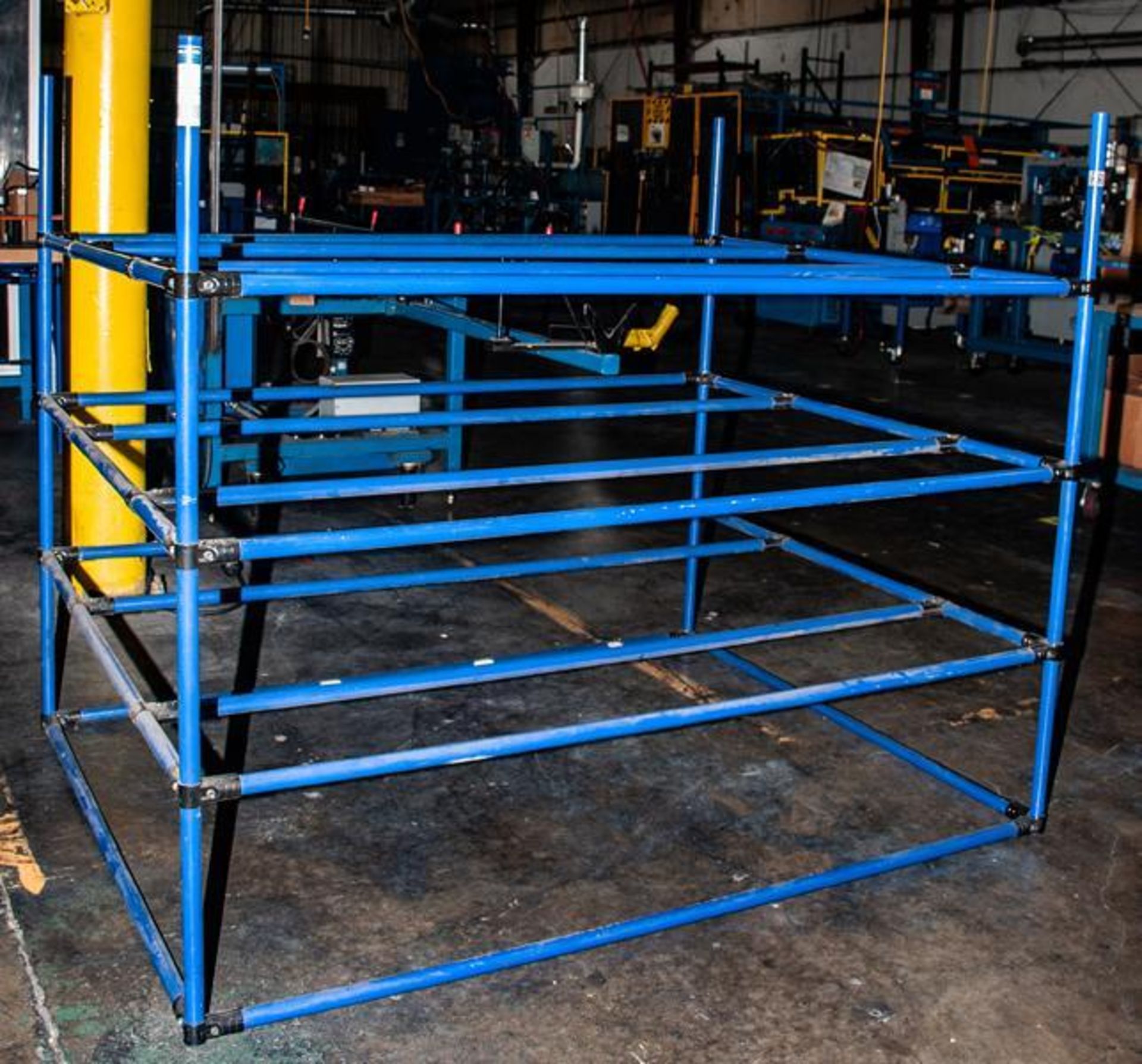 Steel stand approx. 64"L x 48"W x 41"T made with lightweight steel tubing approx. 1" diam. And C